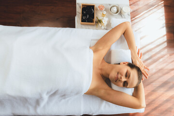 Panorama top view woman customer enjoying relaxing anti-stress spa massage and pampering with...