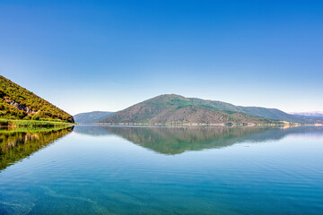 Naklejka premium Mountain Reflections on Calm Lake Prespa