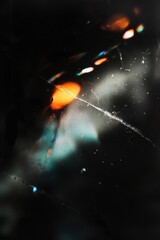 Abstract shot of colorful light reflections on a cracked surface.