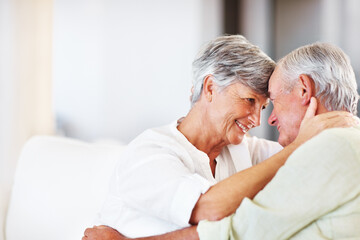 Senior couple, embrace and romance in home for relax, bonding and love with support, care and together. Elderly people, smile and connection in house for weekend break, marriage and happy with trust