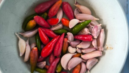 Chili and garlic in blue bowl on table