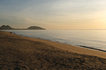 The sun rises at the sea in the morning.