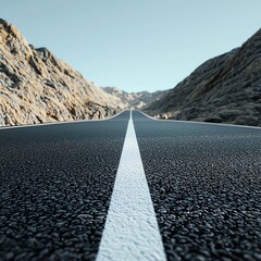 A scenic view of an empty road stretching through rugged mountains under a clear blue sky, inviting adventure and exploration.