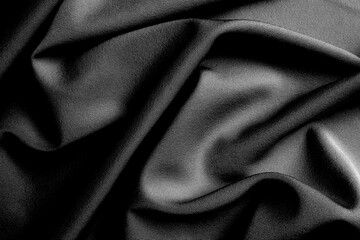 Obraz premium The fabric lies beautifully draped with folds of a bright, rich color.