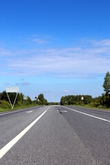 Asphalt road on a clear sunny summer day.	