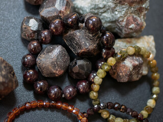 Almandine or almandite stones and bracelets made of them. Garnet minerals