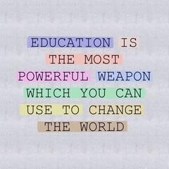 An inspirational quote, “EDUCATION IS THE MOST POWERFUL WEAPON WHICH YOU CAN USE O CHANGE THE WORLD” isolated soft highlighted colour textured background. 