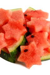 Watermelon pieces cut into a star shape lie on a white background.