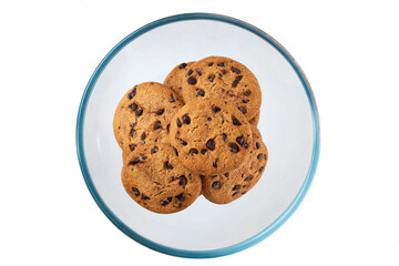 Cookies with chocolate chips in a clear glass bowl isolated on white background, top view.