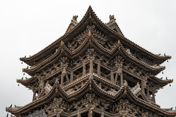 Asian Chinese historical tourist attractions, Feiyun Tower on a rainy day, a pure wooden tower pavilion ancient building. The word 