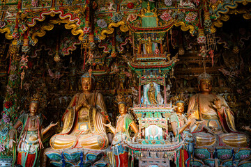 Stone statue of cross-legged Bodhisattva in Cave 18 of Yungang Grottoes, Datong, Shanxi Province