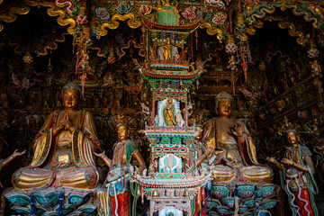 Stone statue of cross-legged Bodhisattva in Cave 18 of Yungang Grottoes, Datong, Shanxi Province