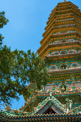 Looking up at the eaves of Feihong Glazed Tower of Guangsheng Temple in Linfen, Shanxi, you can see...