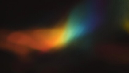 Fototapeta premium Colorful warm rainbow blur light leaks on black background with dust texture
