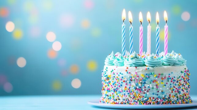 whimsical birthday cake with six candles, pastel blue frosting and sprinkles, soft focus background with space for personalization
