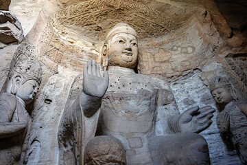 Stone statue of cross-legged Bodhisattva in Cave 16 of Yungang Grottoes, Datong, Shanxi Province