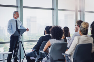 Man, speaker and people at presentation for business, company growth and sharing information in...