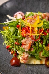 Grilled halloumi salad with cherry tomatoes and quinoa dressing