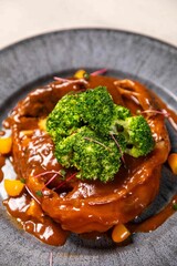Delicious crab dish served with broccoli and sauce on elegant restaurant plate