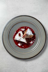 Delicious cake slices being served on a modern plate