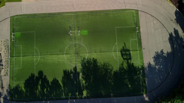 View of the football field and stadium from above. Football school stadium.