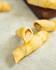 Crunchy shortbread cookies with filling lying on the table