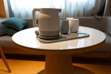 Asian Chinese ceramic tea set in hotel room, warm lighting atmosphere