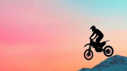 Motocross biker performing a wheelie on a snow-capped mountain pass, extreme and cold, motocross, wheelie, snow