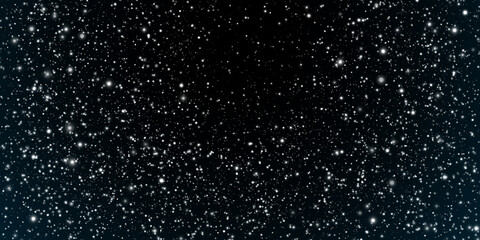 snow falling from night sky