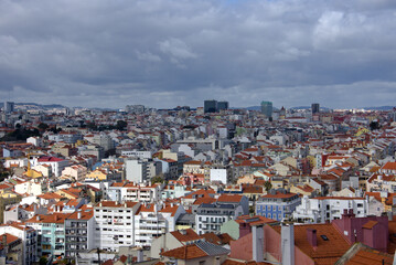 Fototapeta premium Lisbon, Portugal. Lisbon urban buildings panorama landscape, view of colorful buildings. blue sky with white clouds