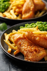 British Fish and chips with mashed peas, tartar and ketchup sauce.