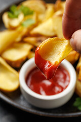 Fried potato dippers with ketchup on a plate