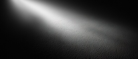 Fototapeta premium Dramatic Spotlight Beam on Dark Textured Background - Perfect for Movie Posters, Thriller Covers, and Horror Scenes