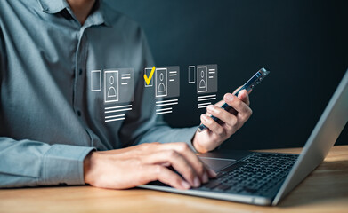 management, marketing, candidate, touch, working, information, social, corporate, network, system. A man is using a laptop and a cell phone. The laptop screen shows a person typing on a keyboard.