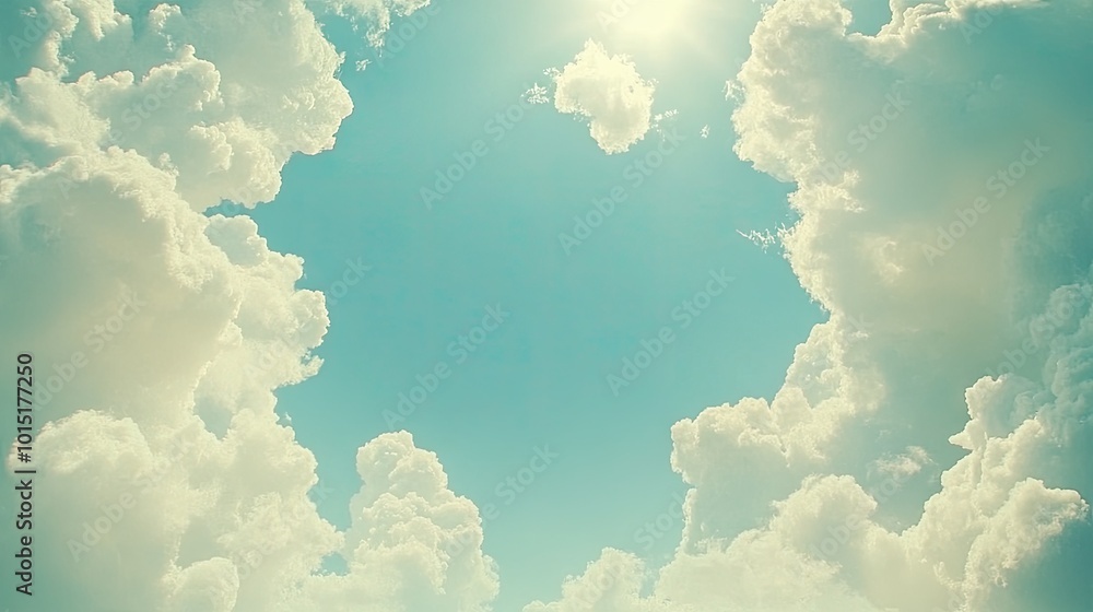 Poster white clouds creating a soft, natural frame around a vibrant blue sky. the open center is perfect fo