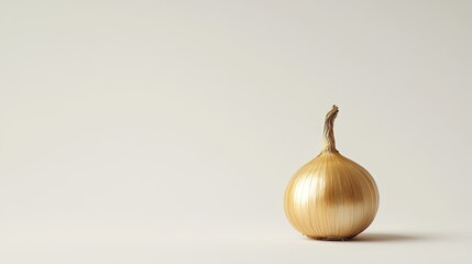 A single golden onion standing alone on a pristine white background, showing its natural texture and clean, simple design.