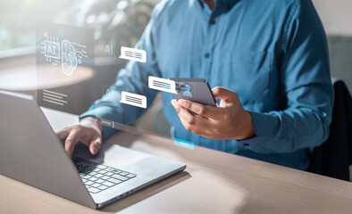 Fototapeta premium marketing, information, social, network, office, professional, finance, commerce, internet, communication. A man is using a laptop and a cell phone. The laptop screen shows a message on the screen.