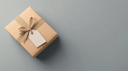 A mockup of a plain gift box with a blank tag on a clean surface, ideal for holiday or special occasion marketing
