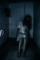 Portrait of asian woman make up ghost face with blood,Horror scene,Scary background,Halloween...