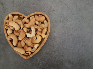 Cashews in a heart shaped bowl.