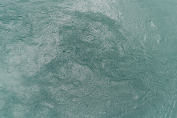 Aerial view of swirling water current from stormy seas
