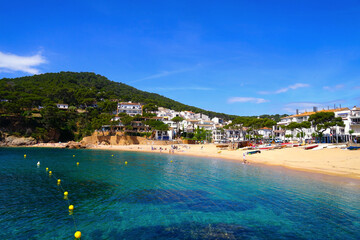 Fototapeta premium beautiful beach of Tamariu in a bay on the Mediterranean Sea with a promenade and a beach, Catalonia, Costa Brava, Girona, Spain
