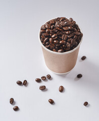 Studio, isolated and coffee beans with cup for cafe, bistro and ingredients for warm beverage. Space, robusta and grains and brown seed by white background for drink, espresso and fresh cappuccino