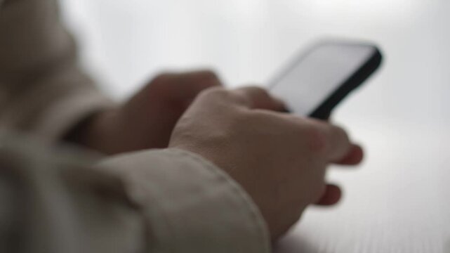 the phone is in the guy's hands.
A man uses a gadget.
Paner types a message on his smartphone.
Work, technology, smart, IT specialist, sms, screen