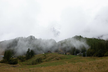 Snow covered peaks of the Sesto Dolomites with clouds in winter, mountains of the Alps, South Tyrol, Italy, Europe