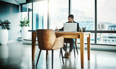 Business, Asian man and writing on journal at office for schedule, calendar and planning as asset manager . Male person, employee and serious as entrepreneur with information for project deadline