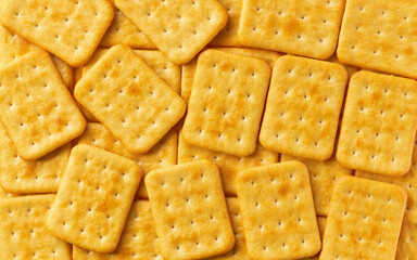 Cheese crackers background, crispy and crunchy cheese crackers, taken from above, close up.