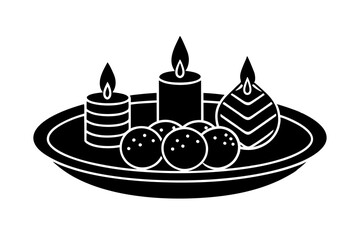 Thali with sweets and candles for Diwali celebration.