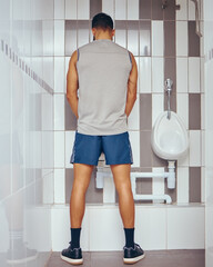 Bathroom, man and back with urinating in toilet for wellness checkup and drug test for performance...