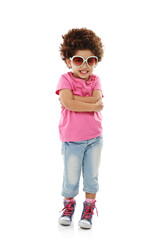 Kid, fashion and portrait with sunglasses in studio for summer style, trendy and funky outfit. Happy, smile and little girl with arms crossed by white background for vacation, clothes or confidence
